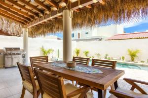 a dining room with a wooden table and chairs at Walkable, Convenient in Downtown Los Barriles in Los Barriles