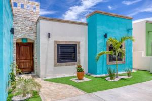 a house with a blue and white facade at Walkable, Convenient in Downtown Los Barriles in Los Barriles