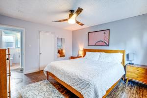 a bedroom with a bed and a ceiling fan at Pet-Friendly Oakland Apt with Hot Tub and Fire Pit! in Oakland