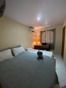 a bedroom with a large bed with a bowl on it at Chácara Paraíso Escondido in Angra dos Reis +28 photos