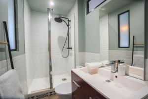 a bathroom with a sink and a shower at LE GOLDEN Gare SNCF - Résidence calme in Laval