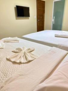 Cama ou camas em um quarto em Humaita Pousada