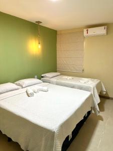 Cama ou camas em um quarto em Humaita Pousada