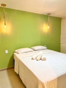 Cama ou camas em um quarto em Humaita Pousada