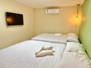 Cama ou camas em um quarto em Humaita Pousada