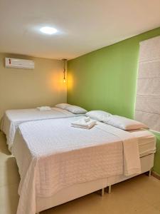 Cama ou camas em um quarto em Humaita Pousada
