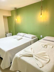 Cama ou camas em um quarto em Humaita Pousada