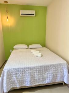 Cama ou camas em um quarto em Humaita Pousada