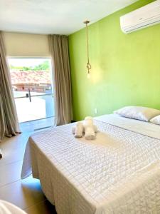 Cama ou camas em um quarto em Humaita Pousada