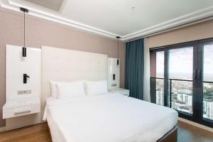 Postel nebo postele na pokoji v ubytování Radisson Residences Avrupa TEM Istanbul