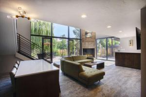 a living room with a couch and a fireplace at Riverside Hotel, BW Premier Collection in Boise