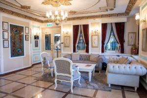 a living room with a couch and chairs and a table at Radisson Hotel Istanbul Sultanahmet in Istanbul