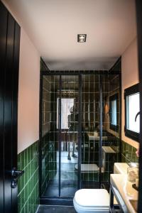 a bathroom with a shower and a toilet at Aldea La Nacha in José Ignacio