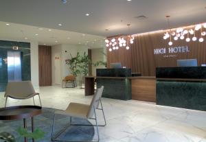 a hotel lobby with a reception desk and chairs at HIGI HOTEL SÃO PAULO in Sao Paulo +72 photos