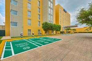 a basketball court painted on the ground in front of a building at City Express by Marriott Minatitlán in Minatitlán