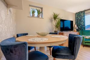 a dining room with a table and chairs at Luxurious Scottish Apartment in Perth
