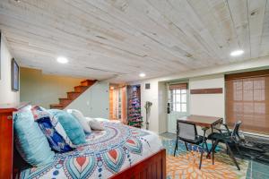 a bedroom with a bed and a wooden ceiling at Beckley Studio with Private Hot Tub and Home Gym! in Beckley
