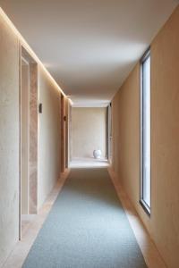 a hallway of a house with a vase in the middle at Hotel Sorrento in Sorrento