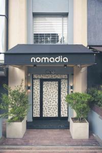 a namiota store with a sign over the door at Nomadia Hostel Boutique in Bogotá