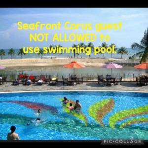 a group of people swimming in a swimming pool at Seafront Corus Resort Port Dickson in Port Dickson