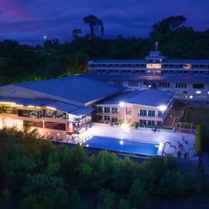 an aerial view of a hotel with a pool at night at Pearl Andaman Resort Ranong Koh Koo 