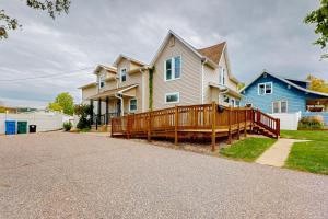 a house with a wooden deck in the driveway at Baraboo's Enchantment - Main in Baraboo