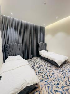 REMAZ ROSE BOULEVARD客房内的一张或多张床位