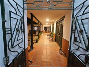 an internal hallway of a house with a basketball hoop at Casa Alba in Cali