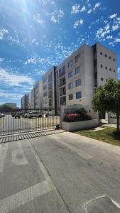 an empty parking lot in front of a building at Departamento 3d y 2b condominio mistral oriente 2 in La Serena