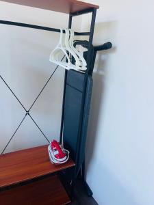 a shelf with a pair of shoes on it at The DreamHouse Homestay in Lahad Datu