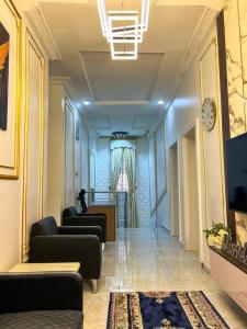a hallway with couches and a television in a building at Luxury Charming 5Bed Duplex With Starlink wifi - Lekki in Ikota