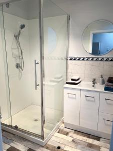 a bathroom with a shower and a sink at Rustic Retreat Esperance in Esperance