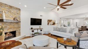 a living room with a couch and a fireplace at Luxe Central Scottsdale 4 bdrm w Backyard Oasis in Scottsdale