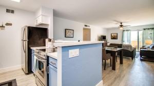 a kitchen and a living room with a counter top at Contemporary Condo in Hub of Old Town Scottsdale in Scottsdale
