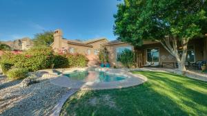 a home with a swimming pool in the yard at North Scottsdale Sanctuary w Htd Pool and Views in Scottsdale