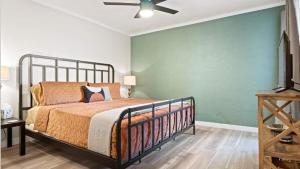 a bedroom with a bed and a ceiling fan at Modern and Sophisticated Old Town Scottsdale Gem in Scottsdale