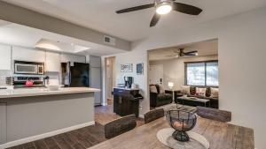 a kitchen and living room with a ceiling fan at Remodeled Tempe Home in Prime Location in Tempe