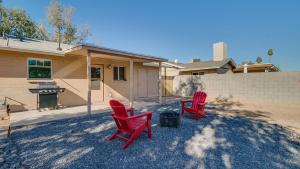 two red chairs and a grill in front of a house at Remodeled Tempe Home in Prime Location in Tempe