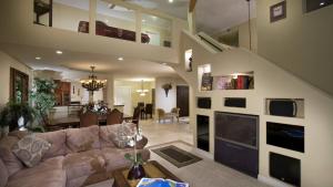 a living room with a couch and a fireplace at The Palm in Scottsdale