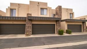 a house with two garage doors on a street at 3 Bdrm Townhouse WGarage in Gated Complex in Phoenix