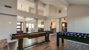 a large living room with a pool table in it at Spectacular Hilltop Home wResort Like Backyard in Fountain Hills
