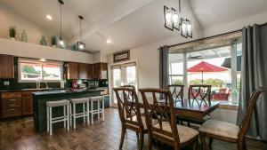 a kitchen with a dining room table and chairs at Spectacular Hilltop Home wResort Like Backyard in Fountain Hills
