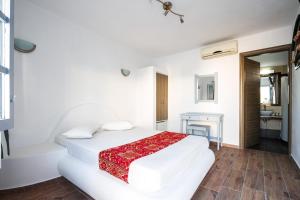 Postel nebo postele na pokoji v ubytování Villa Iliovasilema Santorini
