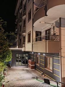 an external view of a building at night at New Armila Suites in Trabzon