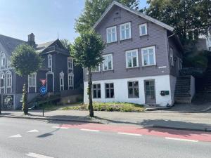 a brown and white house on the side of a street at City Center Getaway - Stavanger BnB 6 by Berti in Stavanger