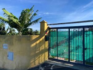 a gate to a house with a view of the ocean at Rural House to take a Break, La Serreria 25 in Tacoronte