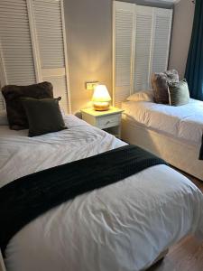 Cama o camas de una habitación en Woodside Lodge, Weybourne, Holt