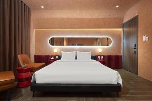 Postel nebo postele na pokoji v ubytování Jacayl Hotel HD