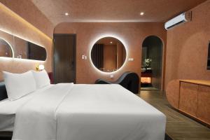 Postel nebo postele na pokoji v ubytování Jacayl Hotel HD