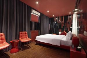Postel nebo postele na pokoji v ubytování Jacayl Hotel HD